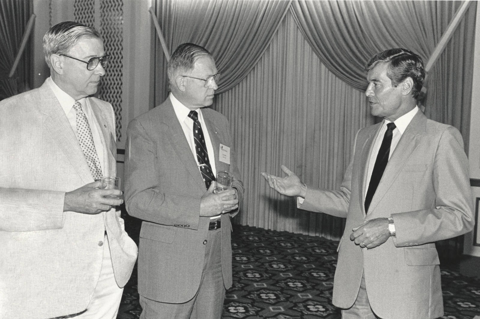Barrett C. & Thomas U. Walker talking with Republican Congressman, Phil Crane, in 1987.
